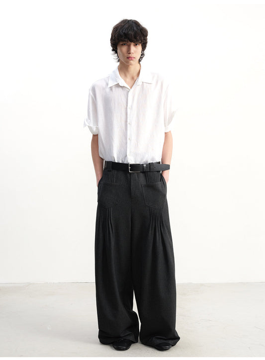 Wide-leg pants with pleated pockets