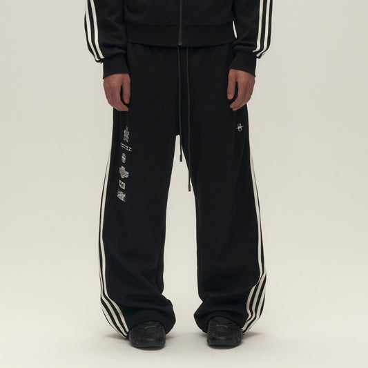 SAVAGEGROWTHWORLD Back-Arc Striped Graphic Track Pants