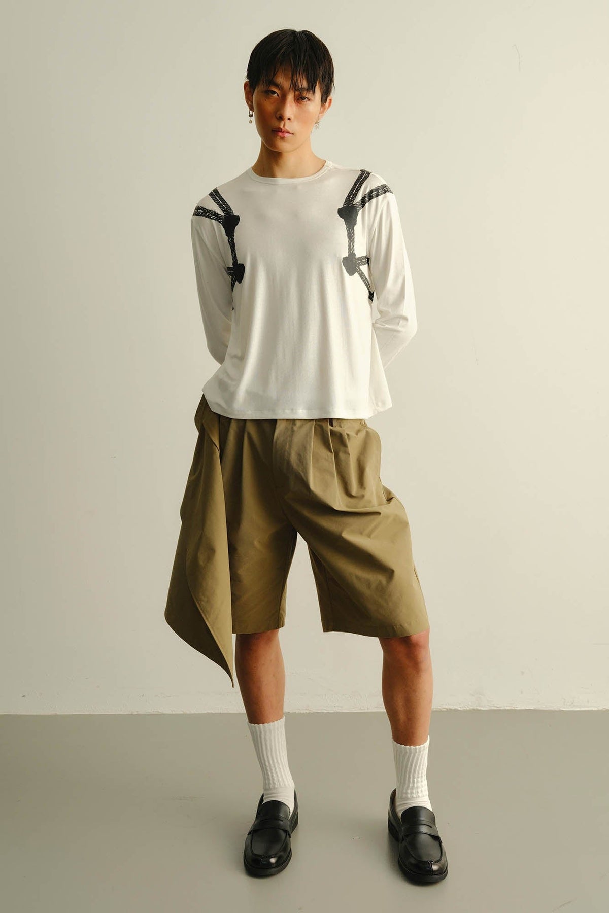 KADAKADA Asymmetrical Overlay Pleated Shorts