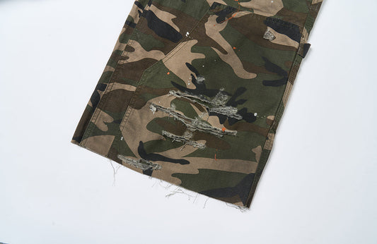 SAVAGEGROWTHWORLD Distressed Paint-Splatter Camo Shorts