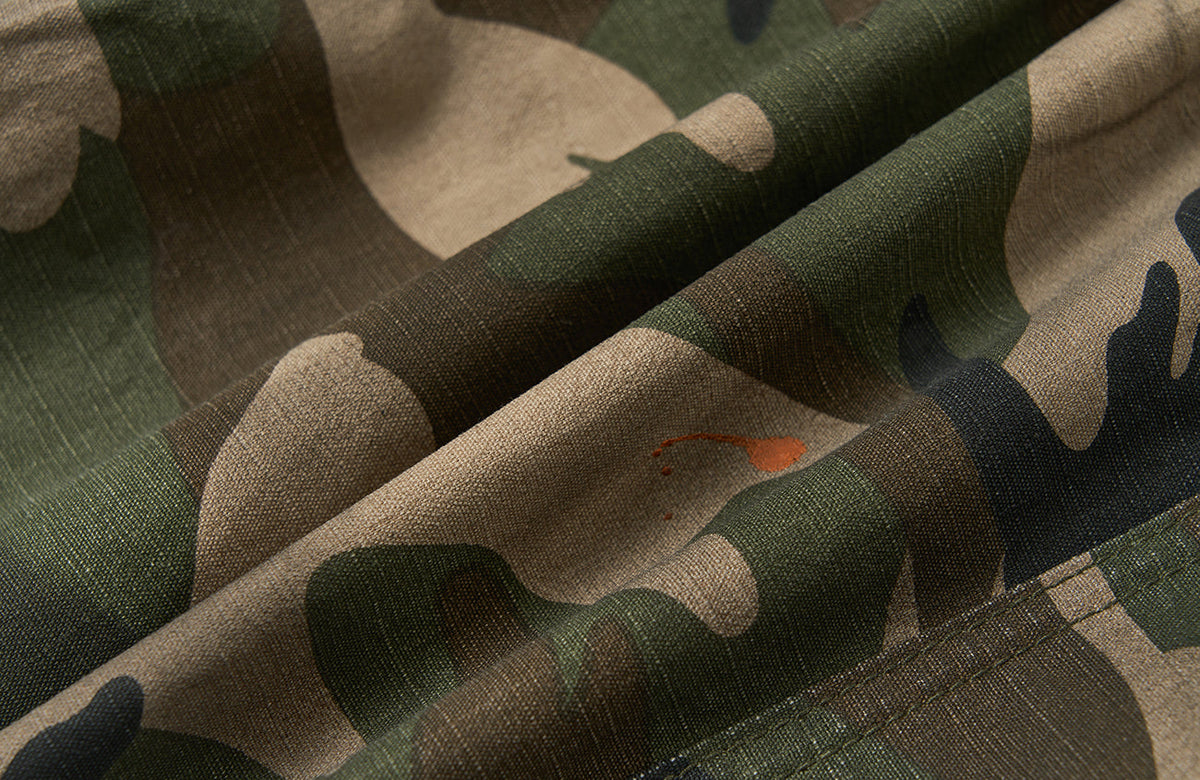 SAVAGEGROWTHWORLD Distressed Paint-Splatter Camo Shorts