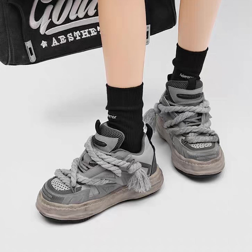 Multi-lace design muted color stained sneakers