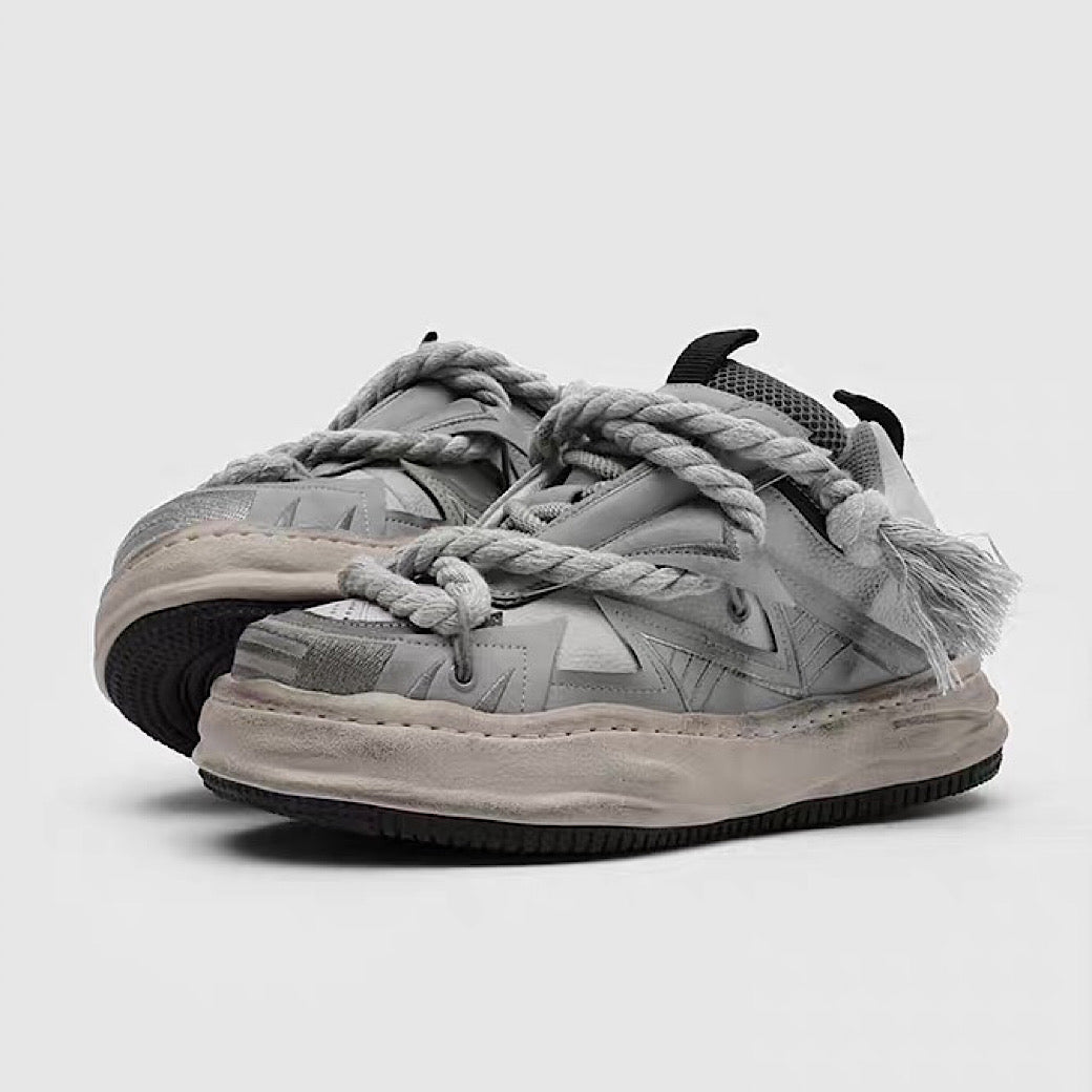 Multi-lace design muted color stained sneakers
